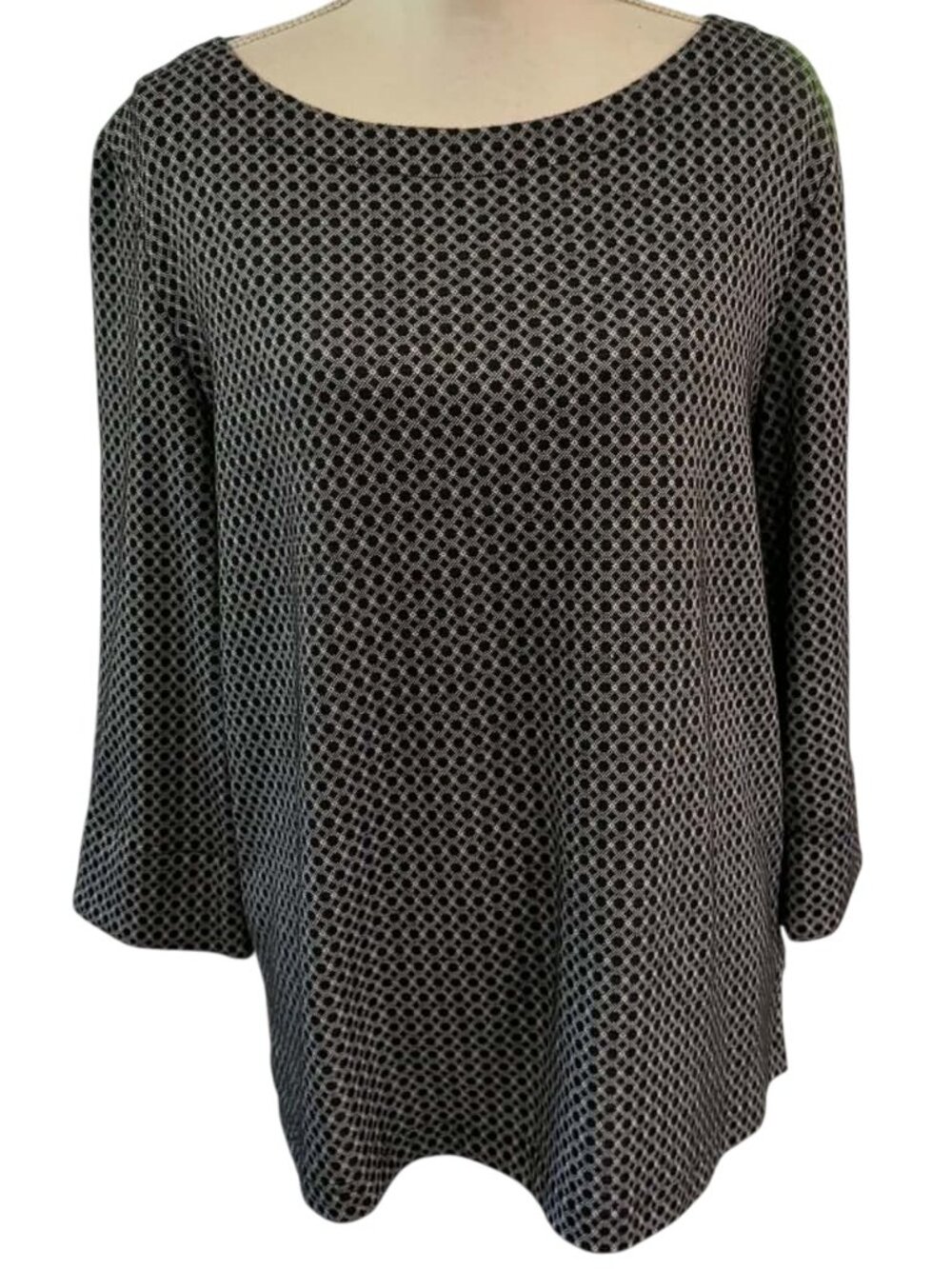 Kim Rogers tunic blouse styled with a boat neckline and cropped 3/4 sleeves.